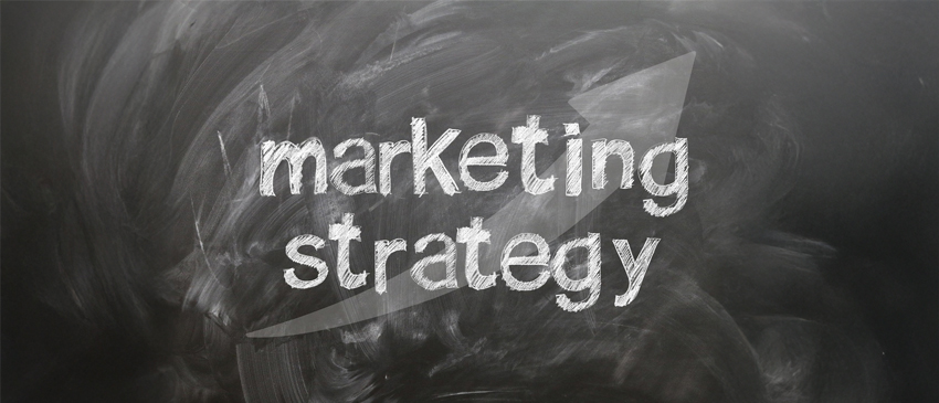 text marketing strategy written on chalkboard